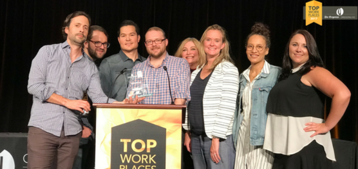 Members of the New Credit America team accept the Top Workplace of 2017 award